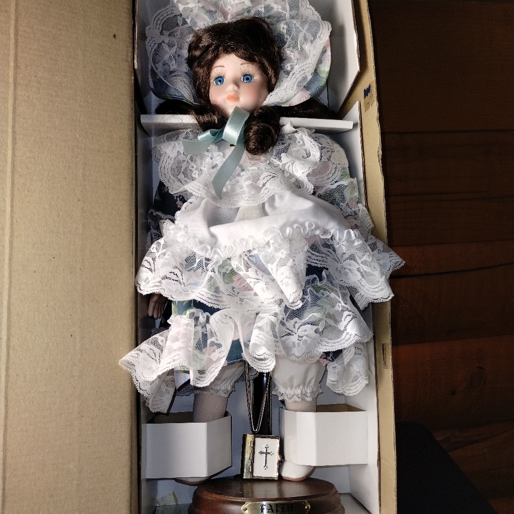 Dolls "Faith" with Bible in hand porcelain doll